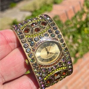 Heidi Daus bejeweled bangle watch. Bronze tone with pink, violet andd citrine.